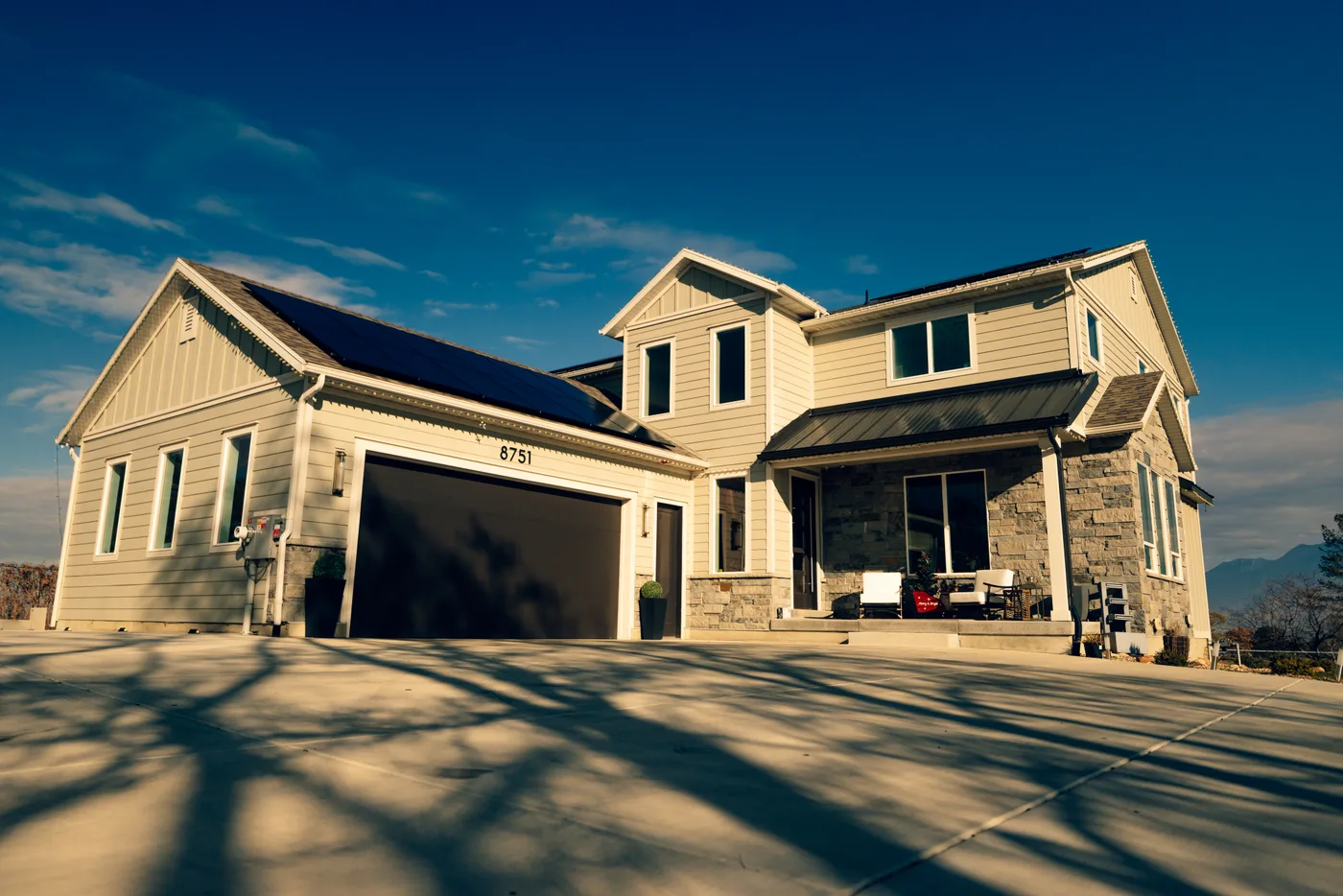 Beautiful Utah home exterior with paver driveway and hardscape